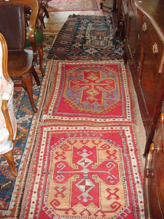 Kazak style rug and a pair of Kazak rugs